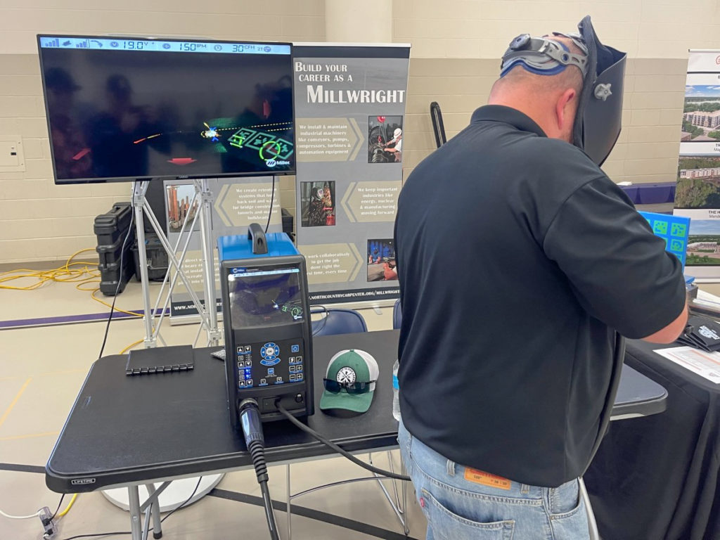 man demonstrating welding at career fair