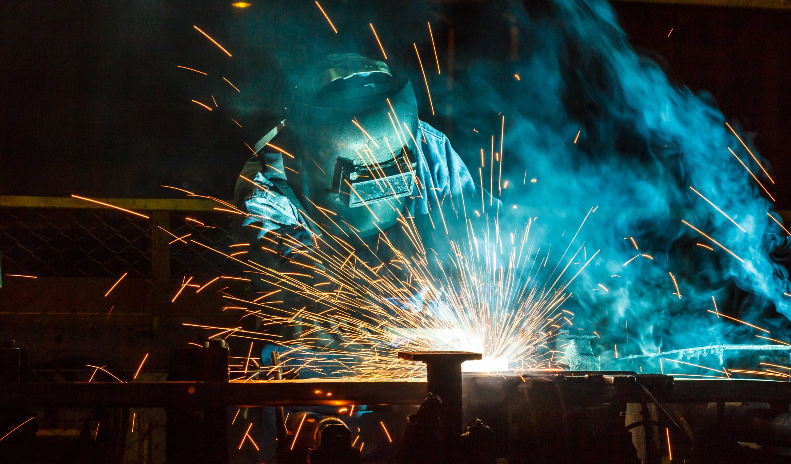 man in welding gear welding 